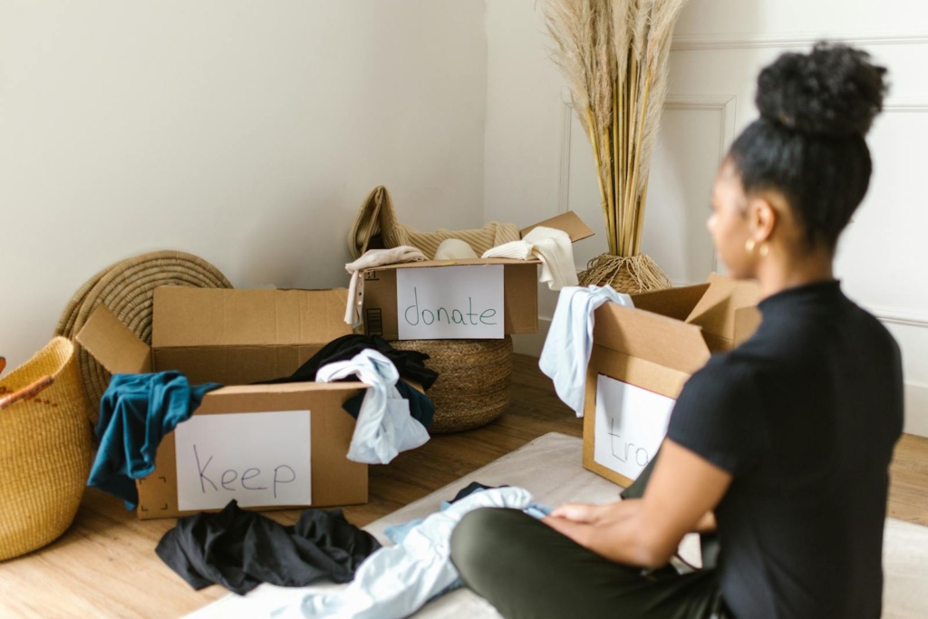 A Woman Sitting in front of Cardboard Boxes